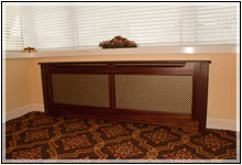 Mahogony radiator cover with anodised gold diamond grille